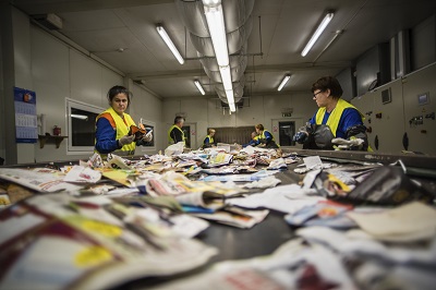 Workers sorting at recycling plant