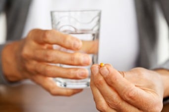 man taking pill